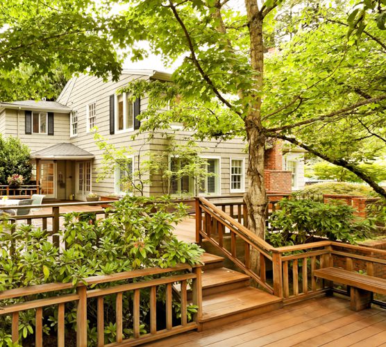 A K Construction | Lake Toxaway, NC | beautiful deck surrounding house, with trees and landscaping